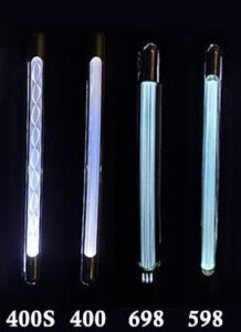 Four vertical fluorescent light tubes glowing against a dark background.