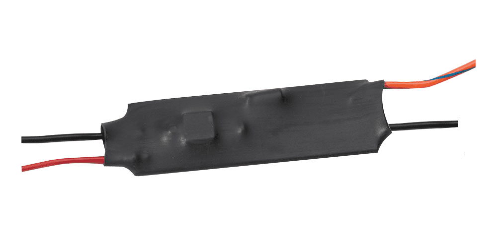 Black electronic component with connected wires.