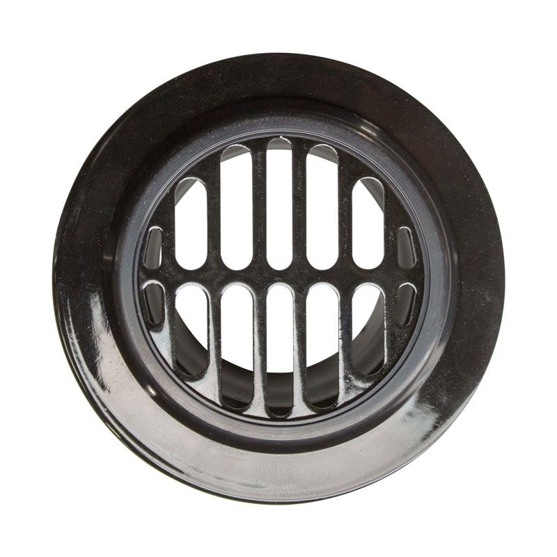 Close-up of a round metal vent cover with vertical slats.