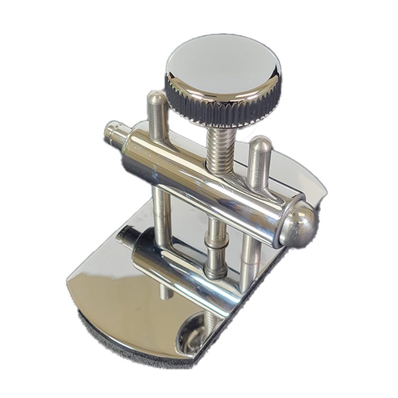 A shiny metal clamp with a knob and a flat base.