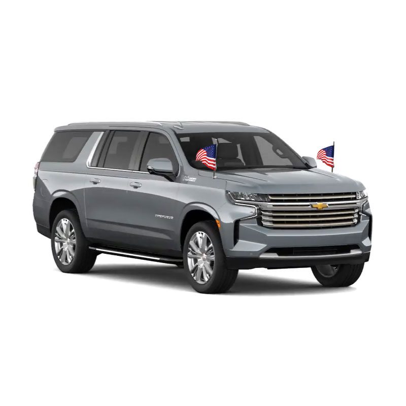 A modern silver SUV with sleek design and American flags on the front.