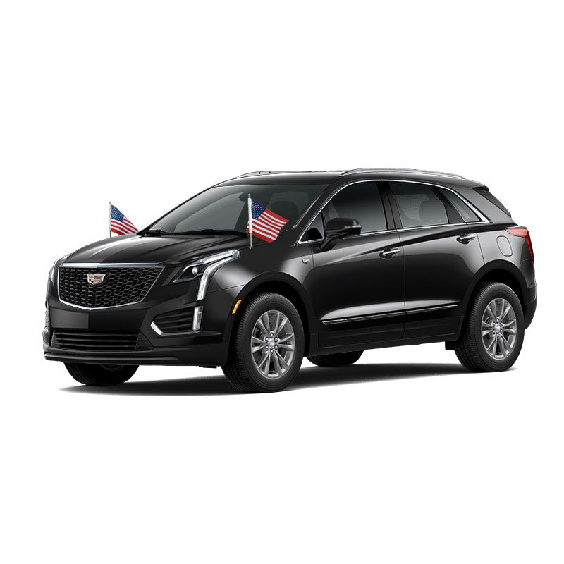Black Cadillac SUV with small U.S. flags on the front.