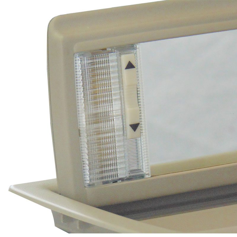 Close-up of a vintage appliance dial with arrow indicators.