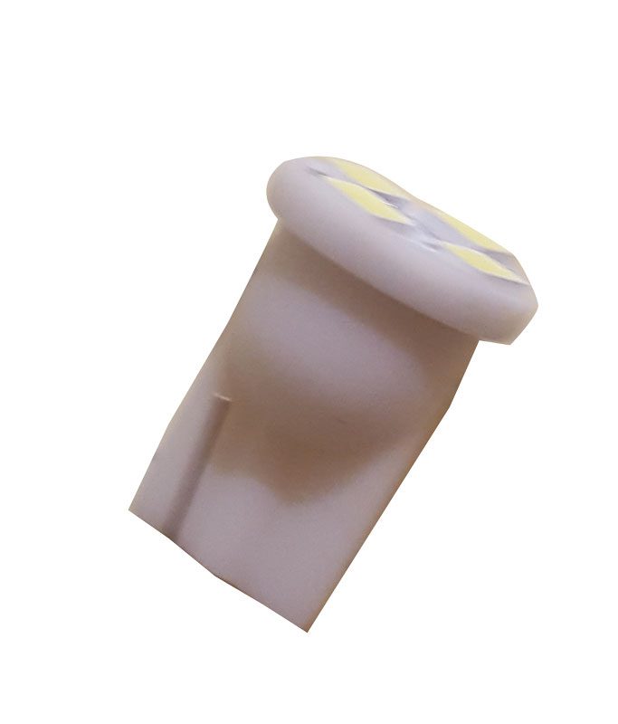 White plastic automotive push rivet clip used for fastening.