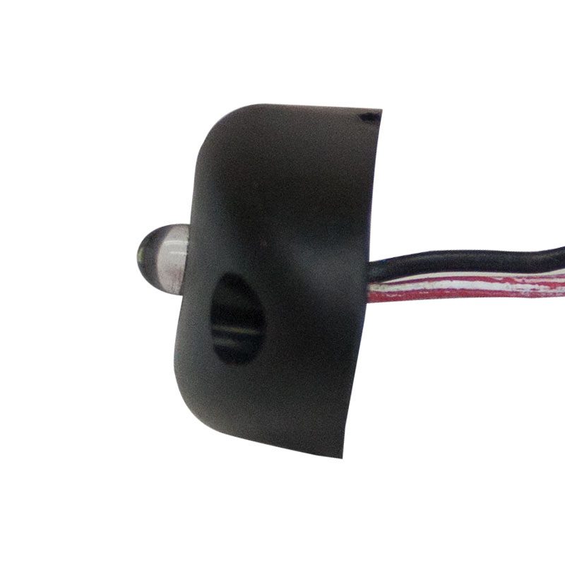 Close-up of a black sensor with connecting wires.