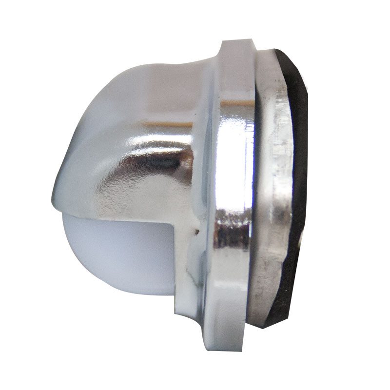 Close-up of a metal and plastic sensor component with a dome shape.