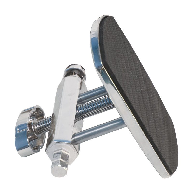 Adjustable footrest with a chrome frame and black padded surface.